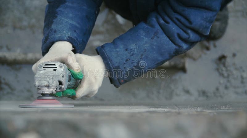 Builder Worker with Grinder Machine Cutting Finishing Concrete Wall at Construction  Site. Clip Stock Photo - Image of blade, hand: 111330572